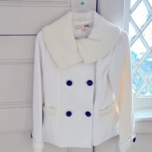 Winter white jacket with knit collar and cuffs featuring black buttons